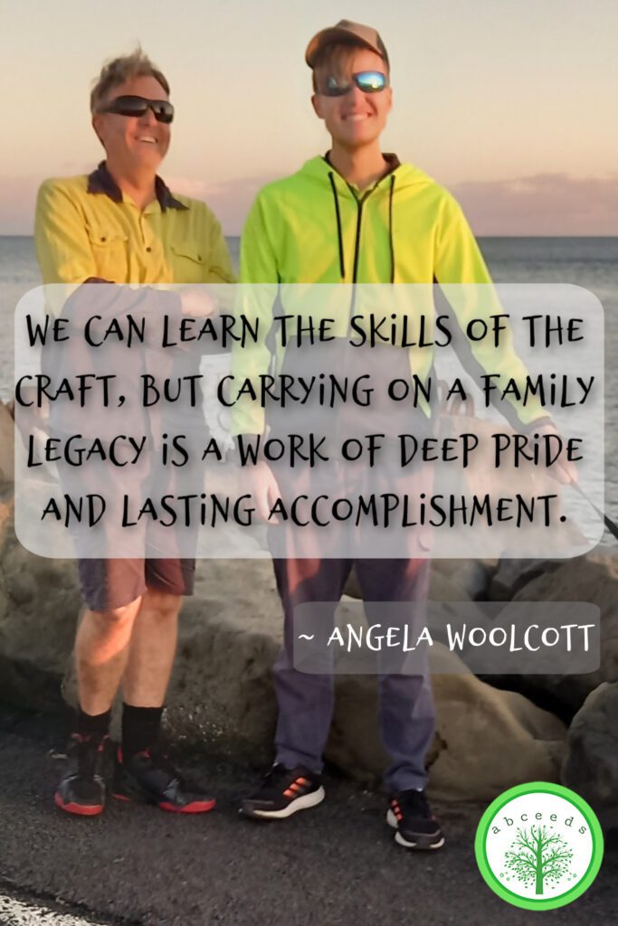 Brad and Toby Woolcott posing on North Wall in Ballina with a positive quote.